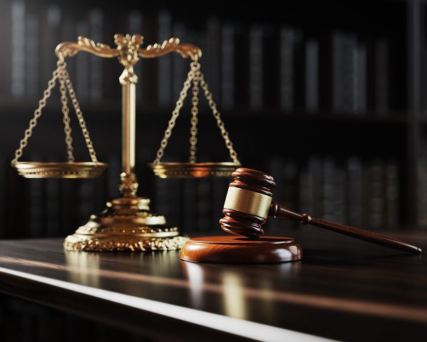 Legal symbols in courtroom setting